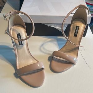 Never worn 7.5 Nine West Teeya Heels. Beige